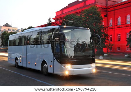 white tourist bus of city lights