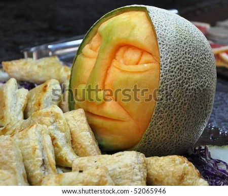 In Olmec style. The melon became a work of art in hands of the cook - artist.