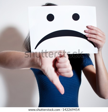 Woman holding a blank paper with sad face