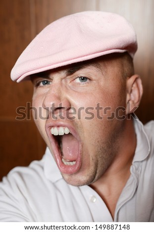 Angry young man screaming. emotion. angry