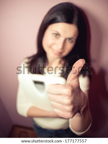 Close-up of woman with Close-up of woman with thumbs-up sign