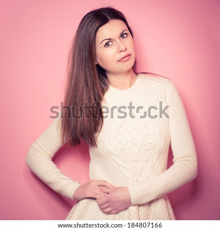beautiful, young woman poses in studio, looks in a camera, emotions. Vogue style