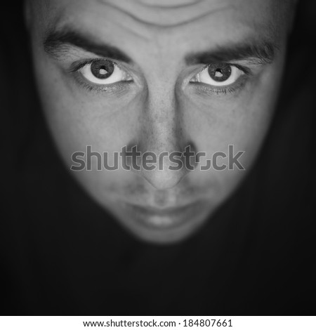 portrait of a young handsome caucasian man . Male model looking at camera. emotion