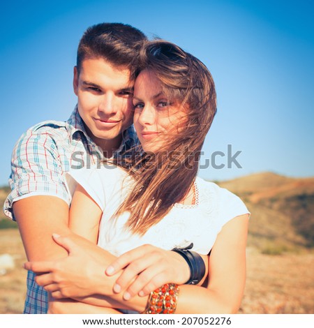 Young couple in love outdoor. Photo with instagram style filters