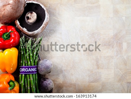 Assorted Organic Vegetables on Cutting Board Background With Copy Space