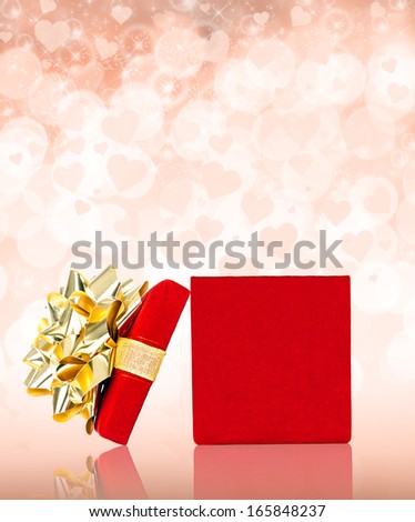 Opened Red Gift Box With Golden Bow for Any Holiday and Celebration Occasion, Isolated on White