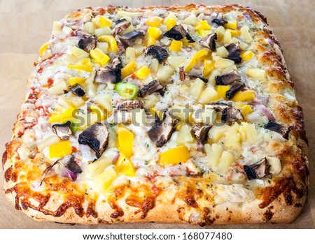 Garlic bread pizza with chicken, mushroom, peppers, onion and cheese
