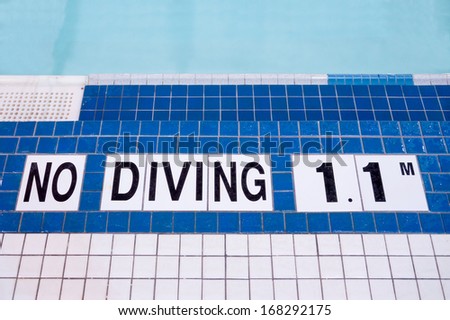 Shallow area of swimming pool, no diving