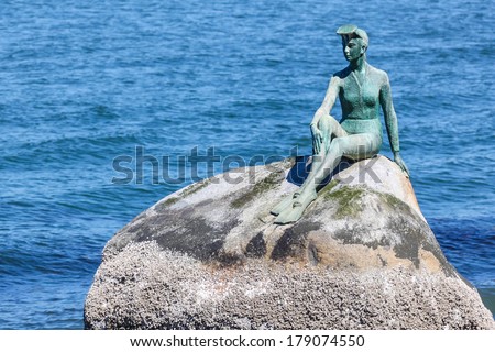 Girl in Wetsuit statue at Stanley Park, Vancouver. The statue represents Vancouver\'s dependence on the sea.