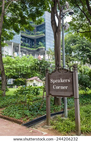 A Speakers\' Corner sign at Singapore\'s Hong Lim Park marks the area where open-air public speaking and debate are allowed where such activities are restricted in other parts of the city.