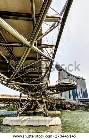 SINGAPORE - MARCH 18: The unique spiral architecture of the Helix Bridge leads to Marina Bay Sands Hotel Mar. 18, 2015. Opened in 2010, the pedestrian bridge links the Marina Center with Marina South.
