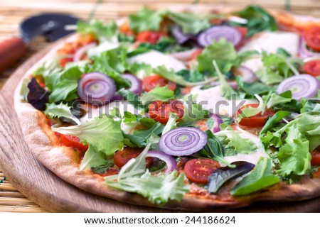 Pizza with salad and onion