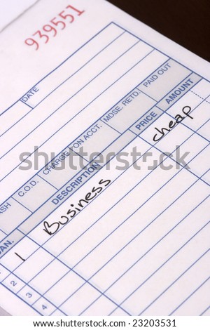 Macro closeup of a sales receipt for purchase of a business inexpensively. Bad economy making businesses sell out cheap.