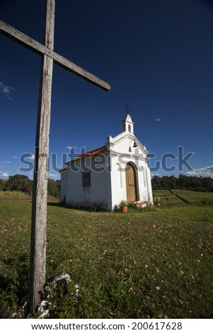 A small church on the hill during the summer season.