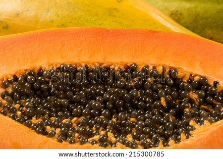 Fresh cut juicy tropical papaya mamao fruit with seeds at Brazilian
