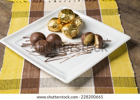 Homemade natural chocolate candies on white background