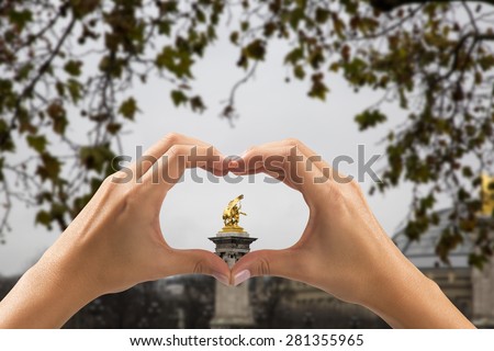 woman making heart with his hand in several places in the world