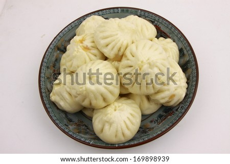 chinese food steamed stuffed bun closeup photograph isolated on white background