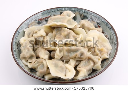 a plate of chinese traditional food dumplings closeup isolated on white background