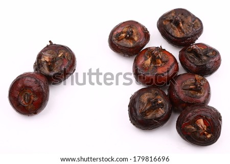 chinese food water nut in piles isolated on white background