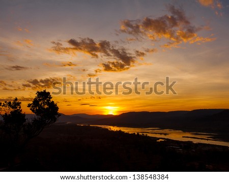 first golden sunrise in thailand. very impressive silhouette sunrise capture.