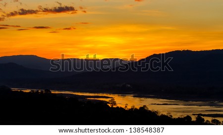 first golden sunrise in thailand. very impressive silhouette sunrise capture.