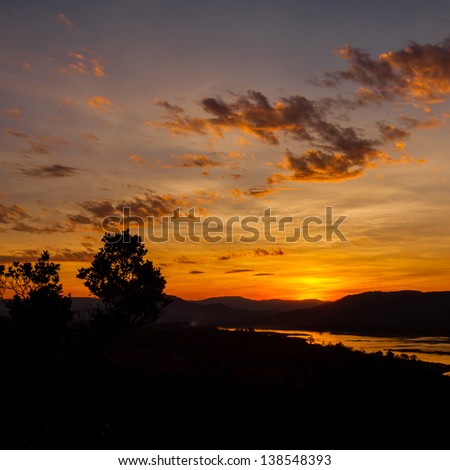 first golden sunrise in thailand. very impressive silhouette sunrise capture. Sunrise over cliff