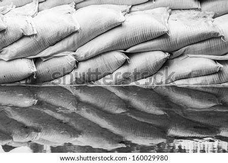 black and white of water barrier of sand bag to prevent flood in thailand
