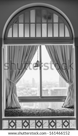 art o f beautiful building window with curtain in black and white