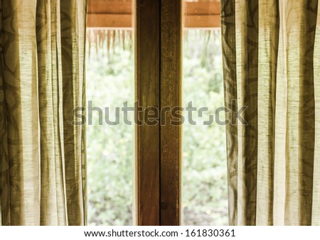 green curtain and glass door