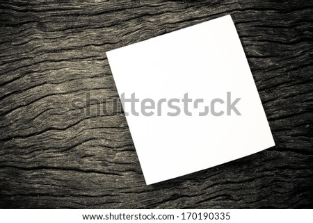 white paper note template on on wood background. black and white