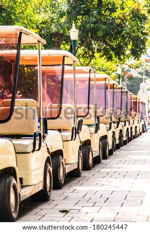 row of electric golf carts