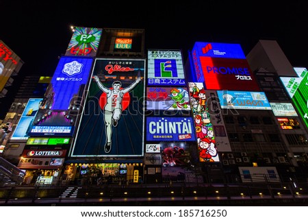 OSAKA, JAPAN - MARCH 23: The Glico Man light billboard and other light displays on March 23, 2014 in Dontonbori, Namba Osaka area, Osaka, Japan. Namba is well known as an entertainment area in Osaka.