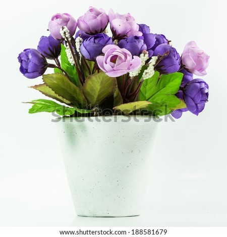 Artificial bouquet of rose flower on white background.