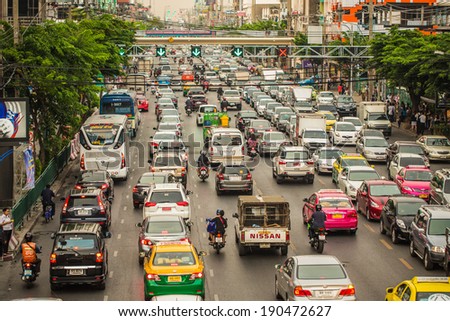 BANGKOK - MAY 2: Traffic moves slowly along a busy road on May 2, 2014 in Bangkok, Thailand. Annually an estimated 150,000 new cars join the already heavily congested streets of Bangkok.