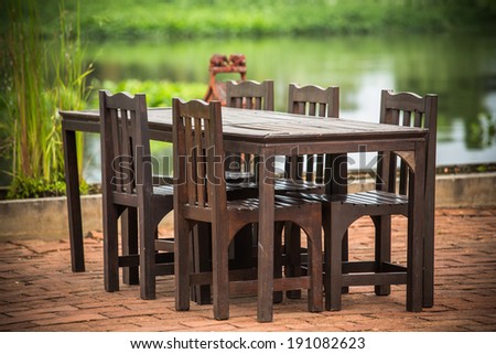Empty wooden table near river