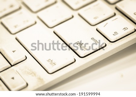 White computer keyboard close-up . vintage style.