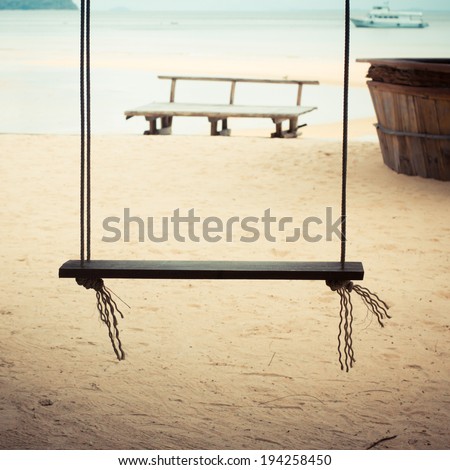 Chain swing on beach. Retro style