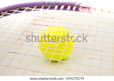 A tennis racket with tennis ball on a white background