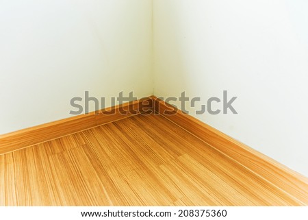 Interior corner of the room with wooden floor