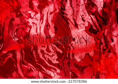 Red glossy paper background.