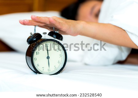 Concept alarm clock with sleep woman.