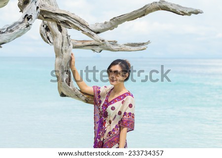 Portrait beautiful Asian girl and beautiful beach and sea, Lipe island, Andaman sea, Thailand.