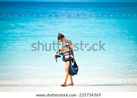 Portrait beautiful Asian girl and beautiful beach and sea, Lipe island, Andaman sea, Thailand.
