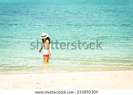 Asian girl and beautiful beach and sea, Lipe island, Andaman sea, Thailand.