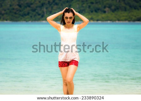 Beautiful Asian woman vacation on beach of Thailand. Lipe island, Andaman sea.