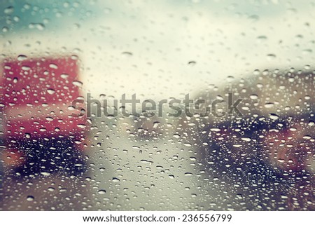 Abstract traffic in raining day. View from car seat.  Background in retro filter.