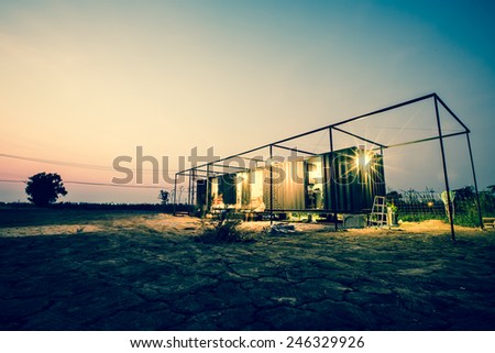 Vintage of container cabin home with twilight sky. Retro filter.