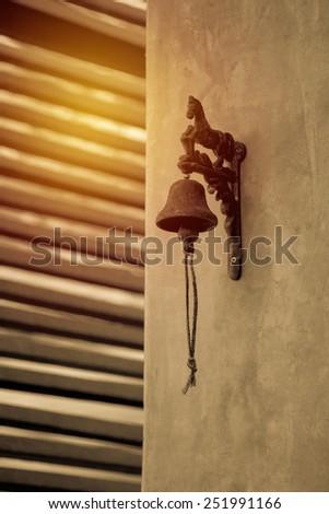 old bell hang on wall. Vintage filter