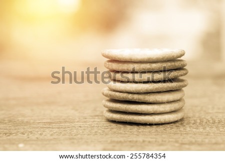 Circle biscuit stack on table. Vintage filter